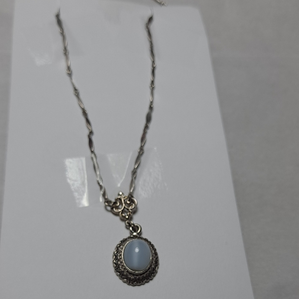 Elegant Silver Necklace with Sky Blue Pendant